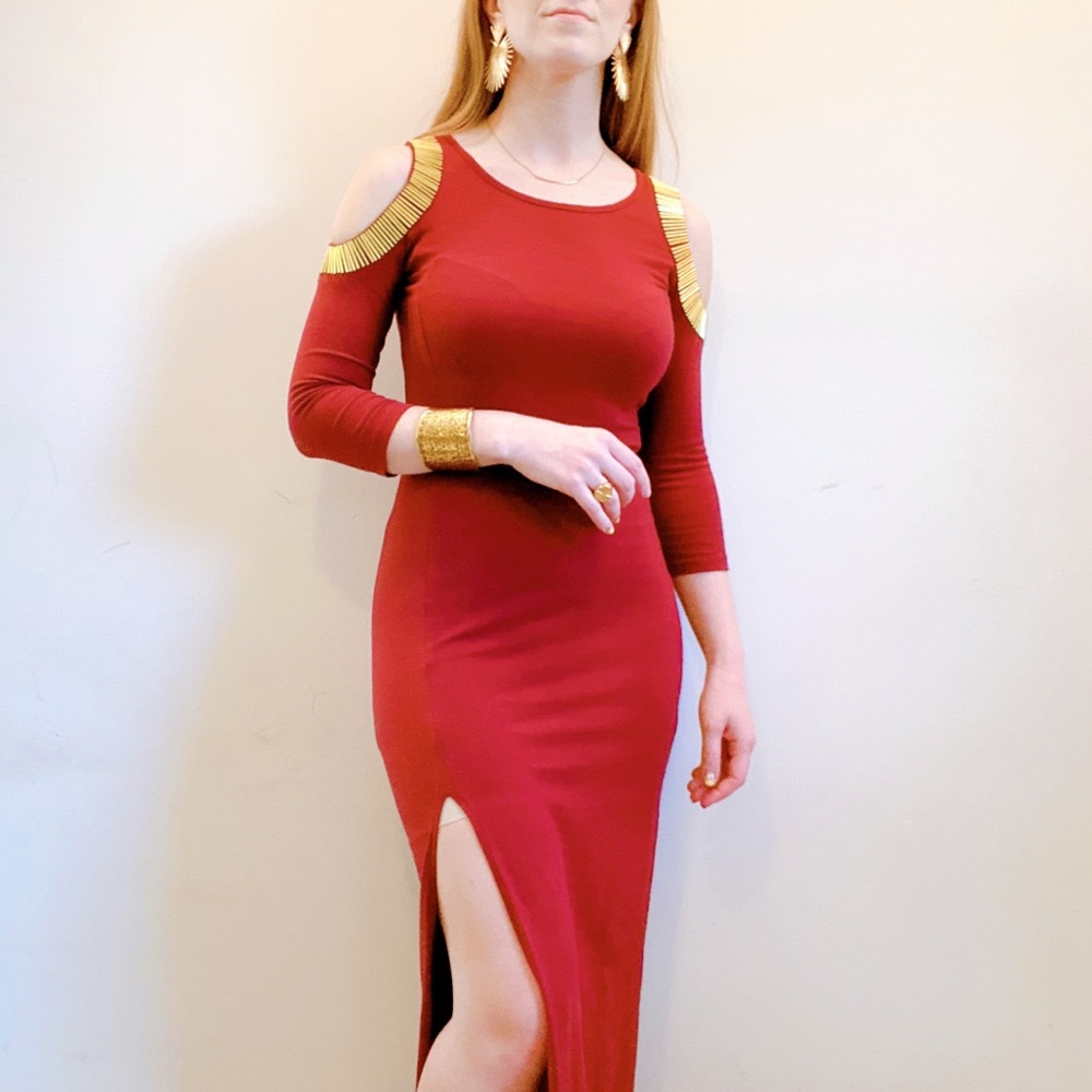 Burgundy gown with gold peekaboo shoulder detail